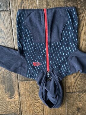 The North Face Navy Jacket with Light Blue Raindrop Print and Red Zip